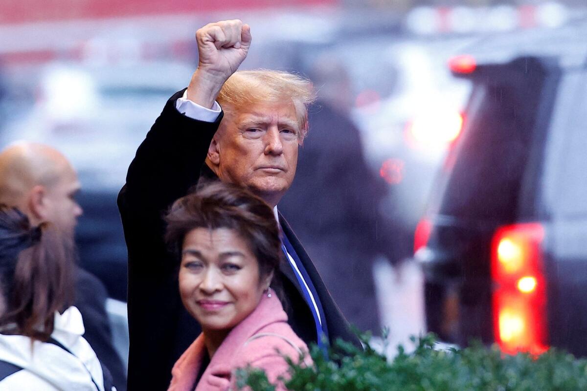 Former US president Donald Trump gestures to his supporters as he departs for his second civil trial after E. Jean Carroll accused Trump of raping her decades ago outside a Trump Tower in the Manhattan borough of New York City on Thursday. — Reuters