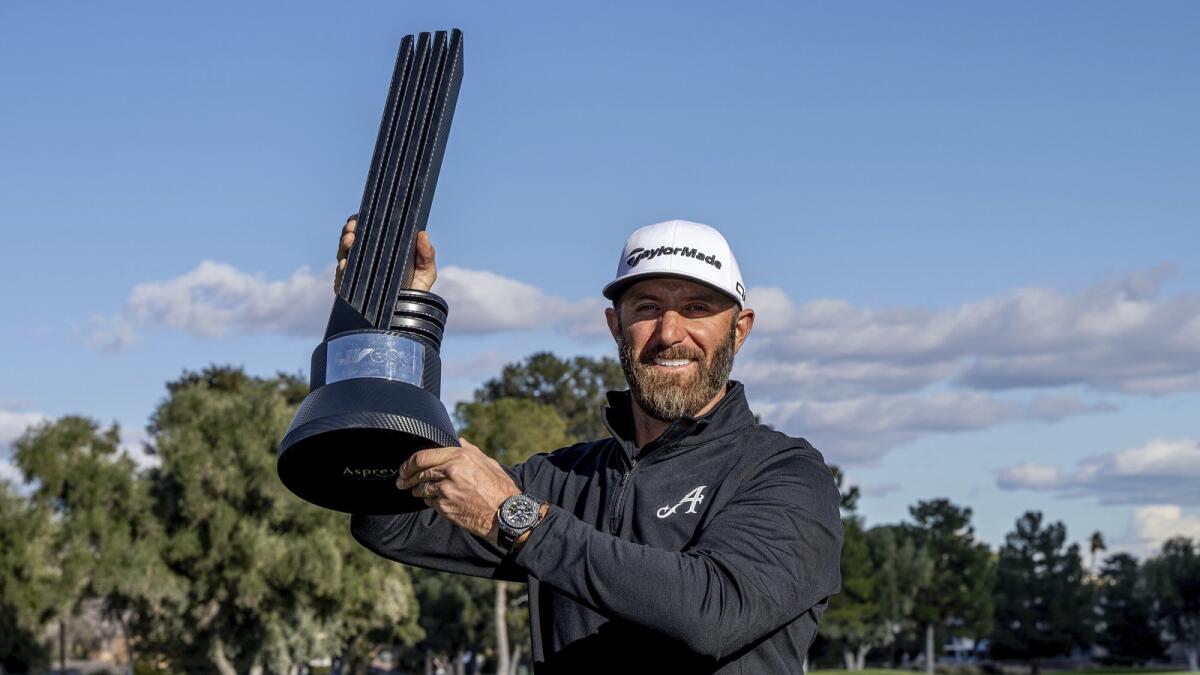 First-place individual champion captain Dustin Johnson, of 4Aces GC, poses with the trophy after the final round of LIV Golf Las Vegas earlier this month. - AP