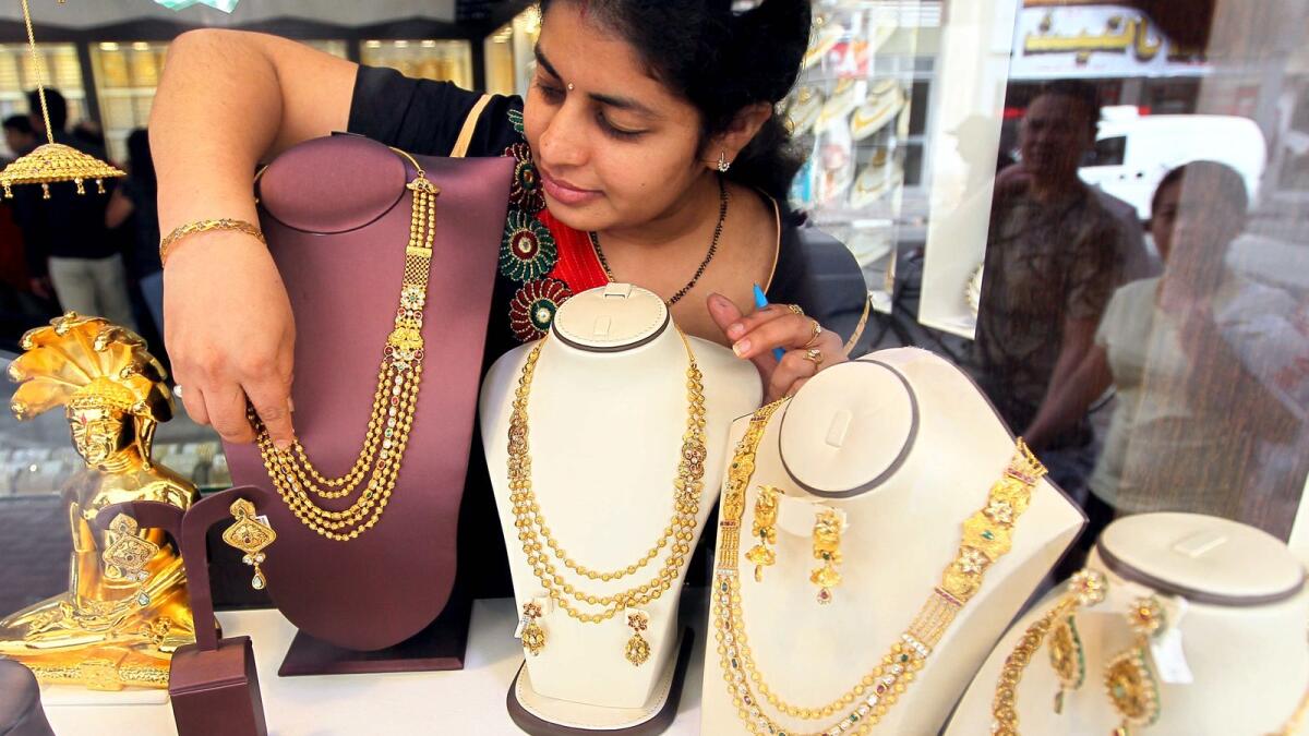 People looking and buying gold at the jewellery shop. Gold fell 3.5 per cent in July, leaving it down 2.9 per cent on the year at $1,753 per tory ounce. — File photo