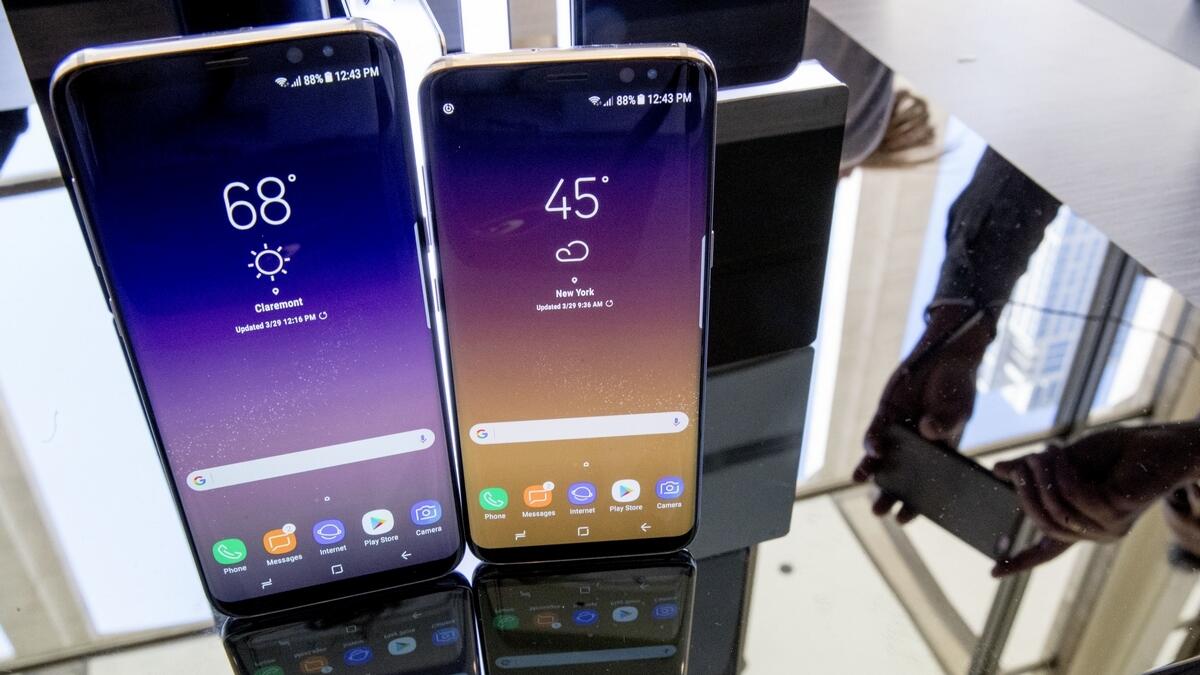 The Samsung Galaxy S8, right, and S8 Plus on display 