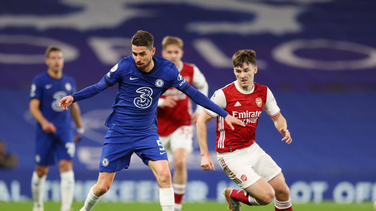 Chelsea's Jorginho (left) challenges for the ball with Arsenal's Kieran Tierney. (AP)