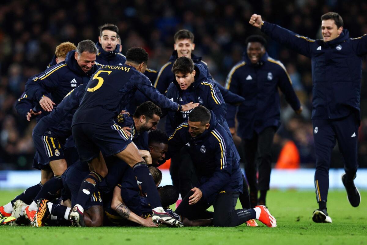 Real Madrid players celebrate after beating Manchester City. — AFP