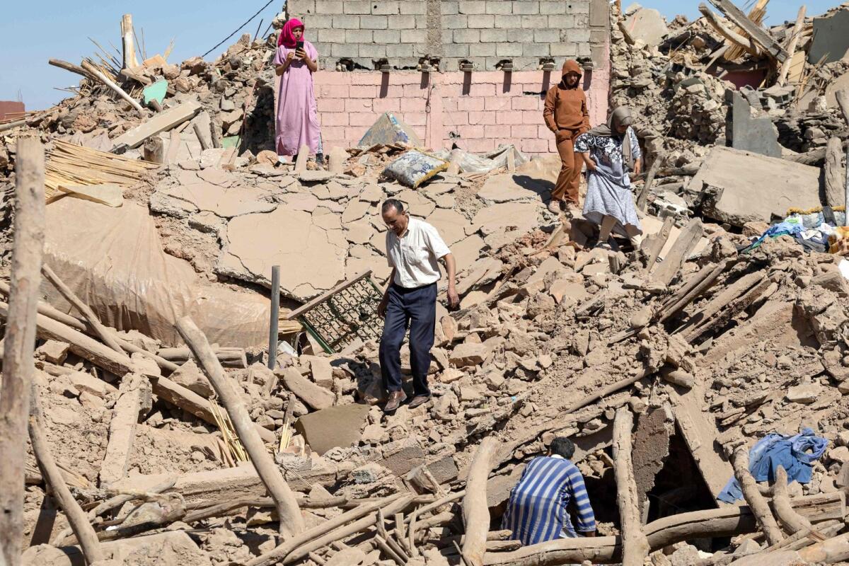 Villagers inspect the rubble of collapsed houses in Tafeghaghte, 60 kilometres (37 miles) southwest of Marrakesh, on September 10, 2023. Photo: AFP