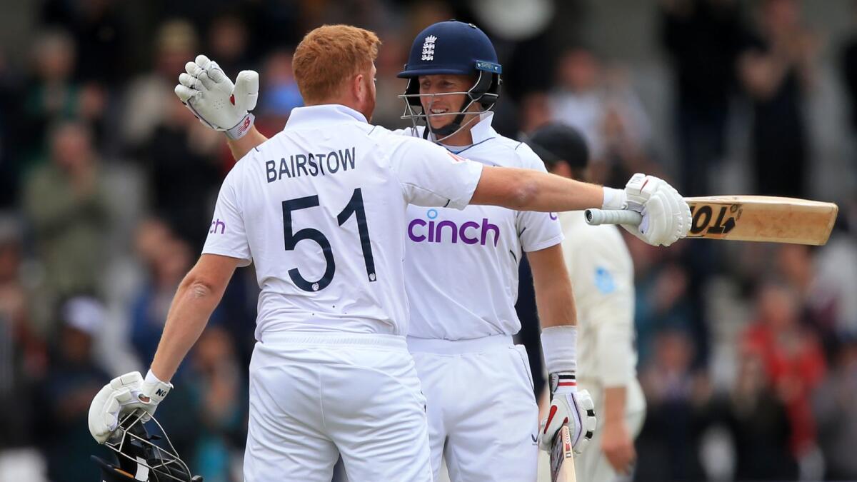 England's Joe Root (right) and Jonny Bairstow. — AFP