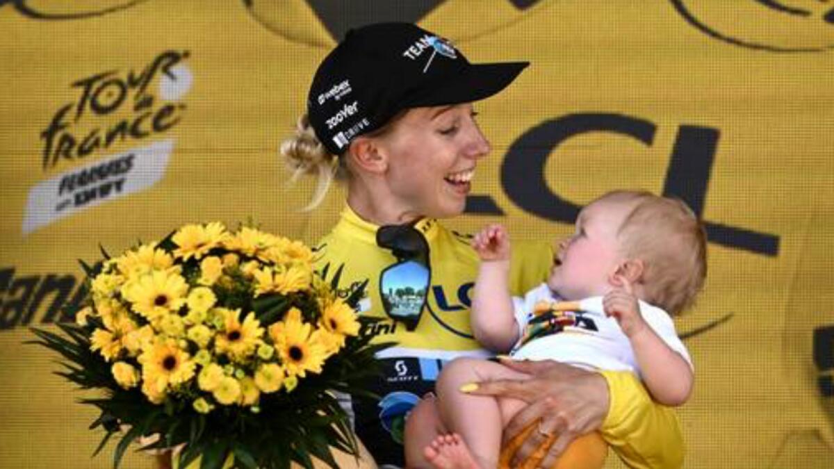 Lorena Wiebes of the Netherlands celebrates with her child on the podium. — AFP