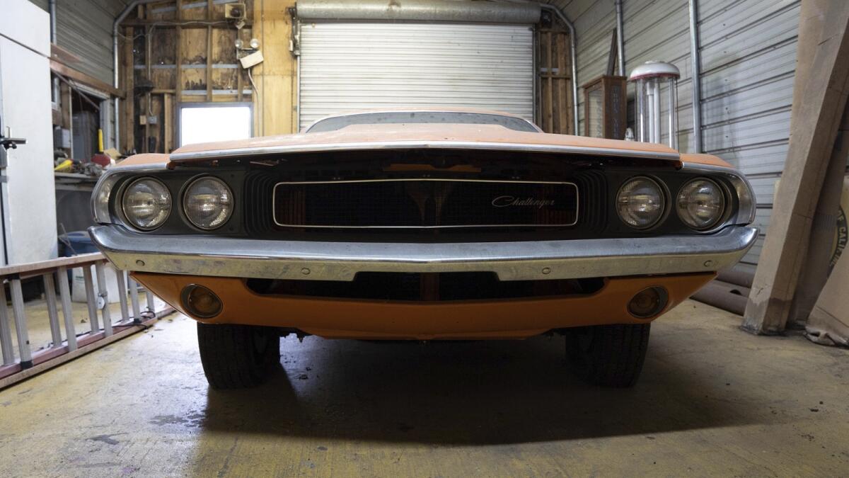 A 1970 Dodge Challenger owned by the late car enthusiast Leroy Gonzalez, is parked near his office, in Seffner, Florida. Stellantis automobile corporation will stop making petrol versions of the Dodge Challenger and Charger and the Chrylser 300 big sedan by the end of this year. - AP file