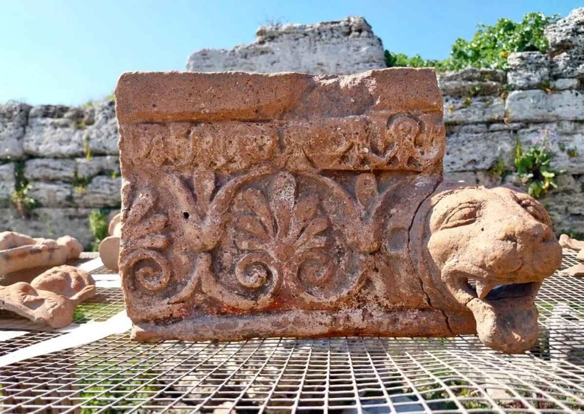 Photo shows an architectural element with a leonine protome drip found in a newly discovered sanctuary, which dates from the 5th century BC, that was first identified in 2019 along the ancient city walls of Paestum, Southern Italy. — AP