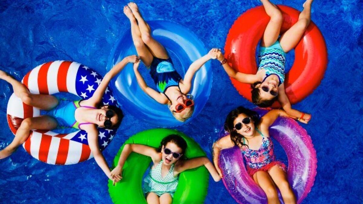 Girls enjoying a a water pool