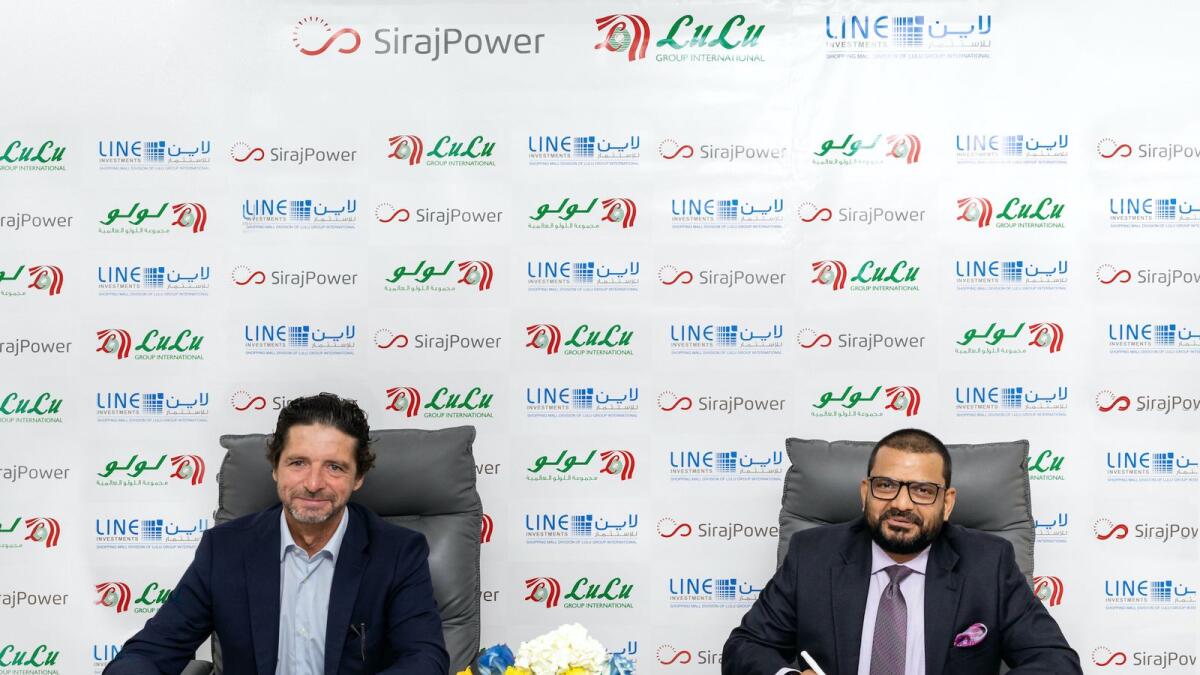 Laurent Longuet, CEO at SirajPower; and Salim M.A, director of Lulu Group International, signing the agreement. — File photo