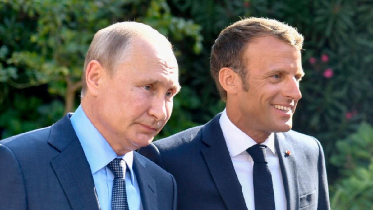 Vladimir Putin and Emmanuel Macron. — AP file
