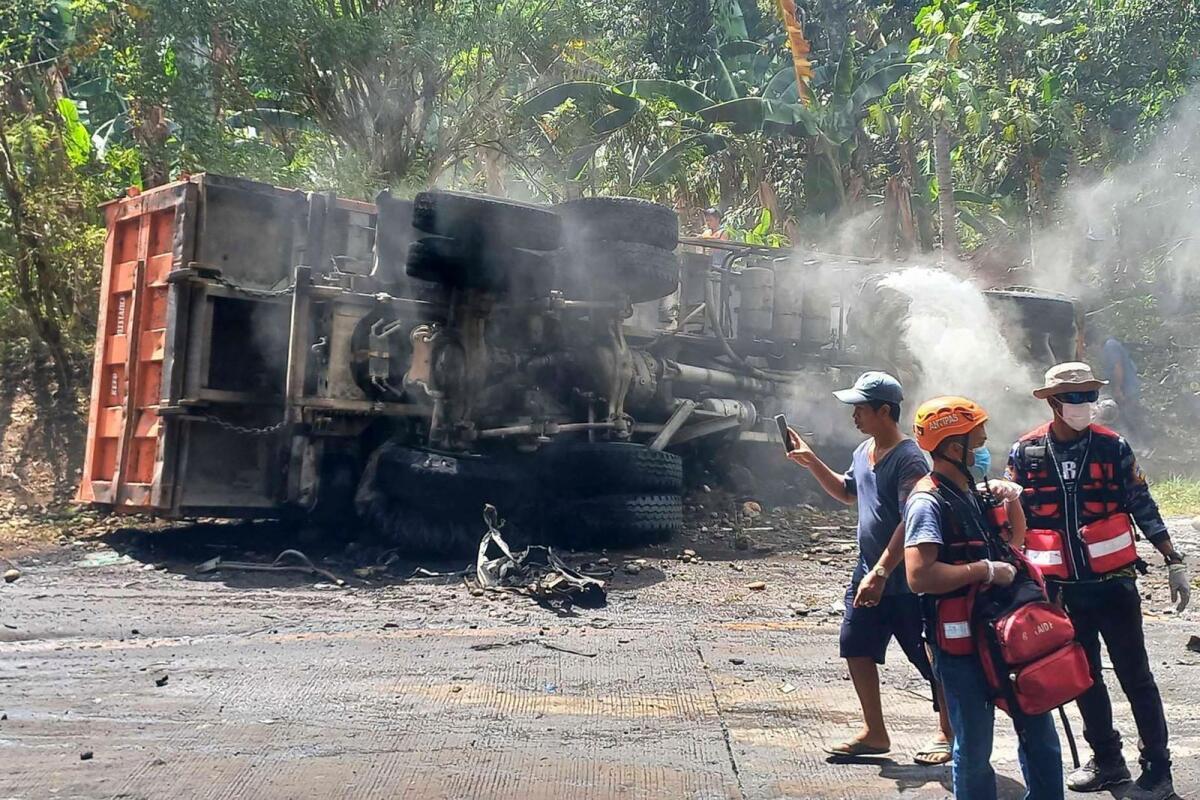 An overturned truck following an accident in Antipas, North Cotabato.— AFP