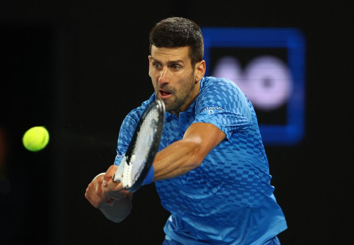 Serbia's Novak Djokovic hits a backhand return during the second round match against France's Enzo Couacaud. — Reuters