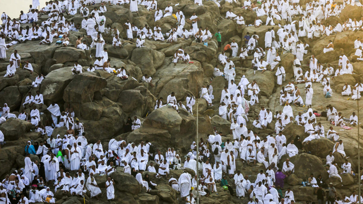 Pilgrims stand at Mount Arafat on peak day of Haj