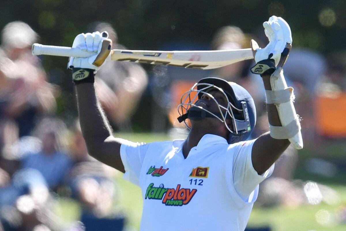Sri Lanka's Angelo Mathews celebrates after reaching his century. — AFP