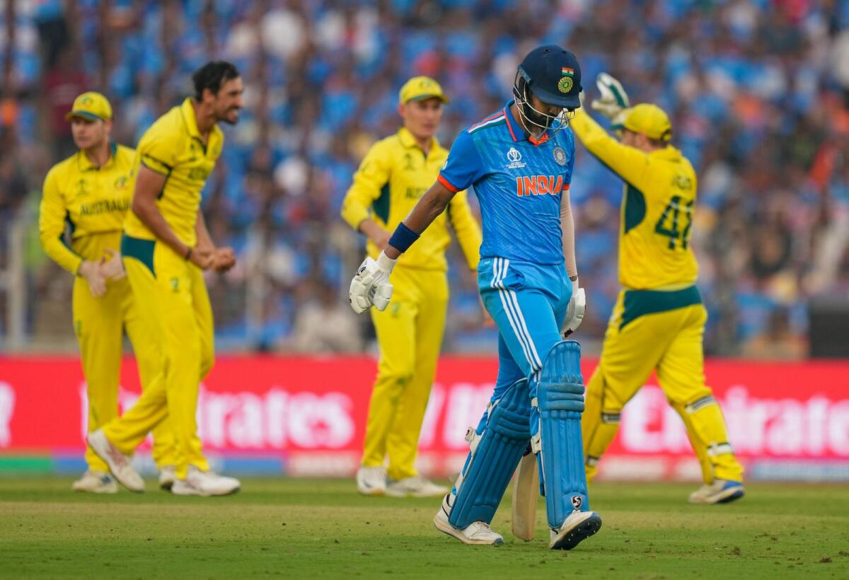 Australia's Mitchell Starc celebrates with teammates after taking the wicket of India's KL Rahul. — PTI
