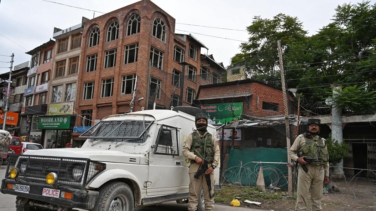 Indian paramilitary troopers stand guard in Srinagar following an attack to a Central Reserve Police Force (CRPF) patrol in south Kashmirs Anantnag district.-AFP 