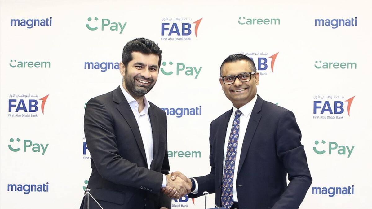 Mudassir Sheikha (left), CEO of Careem, and Ramana Kumar (right), CEO of Magnati, sign an agreement to enable next-generation payment services on the Careem app.