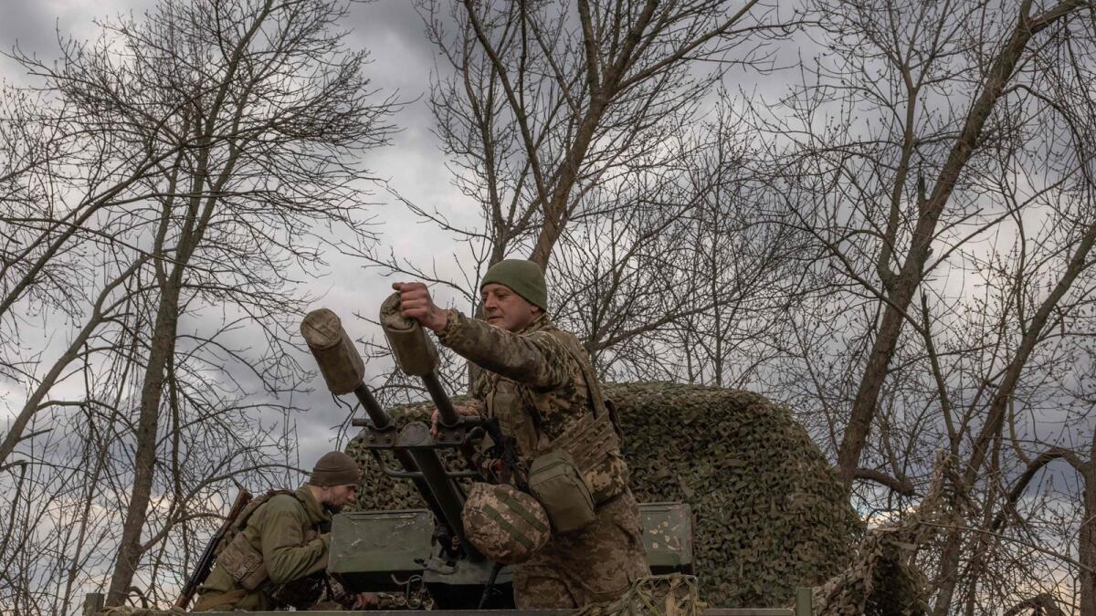 Ukrainian servicemen at a position in the Zaporizhzhia region. — AFP