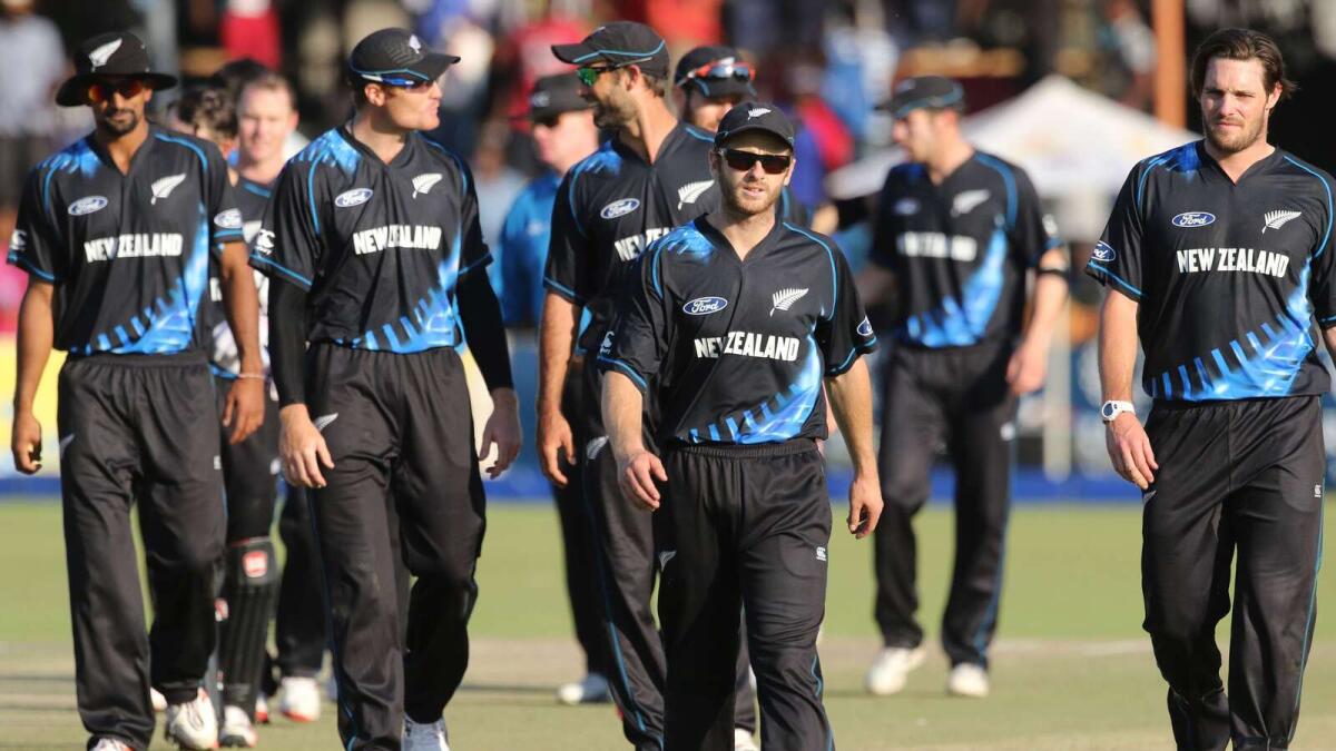 Kane Williamson (centre) leads his team off the pitch after winning a Twenty20I against Zimbabwe on August 9. 