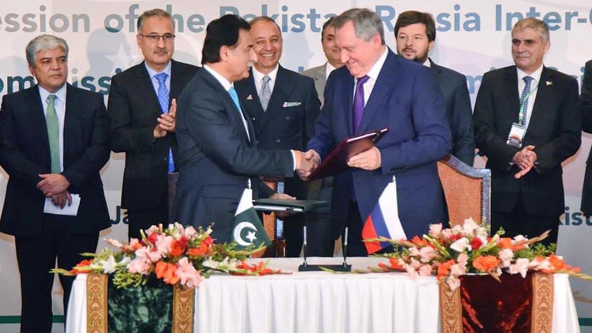Pakistan's Federal Minister for Economic Affairs Sardar Ayaz Sadiq and Russian Energy Minister Nikolay Shulginov after signing an agreement in Islamabad on Friday. — APP