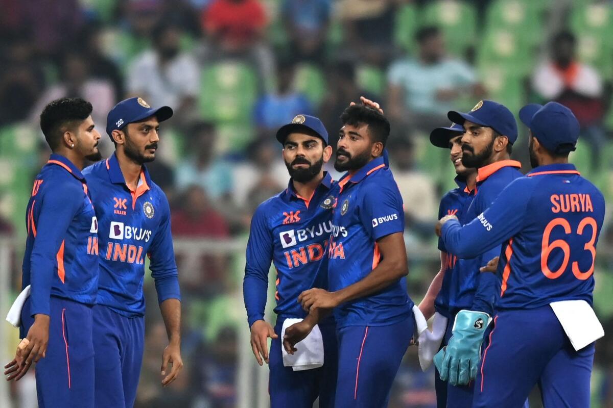 India's Mohammed Siraj (centre) celebrates with teammates after taking the wicket of Sri Lanka's Kusal Mendis. — AFP