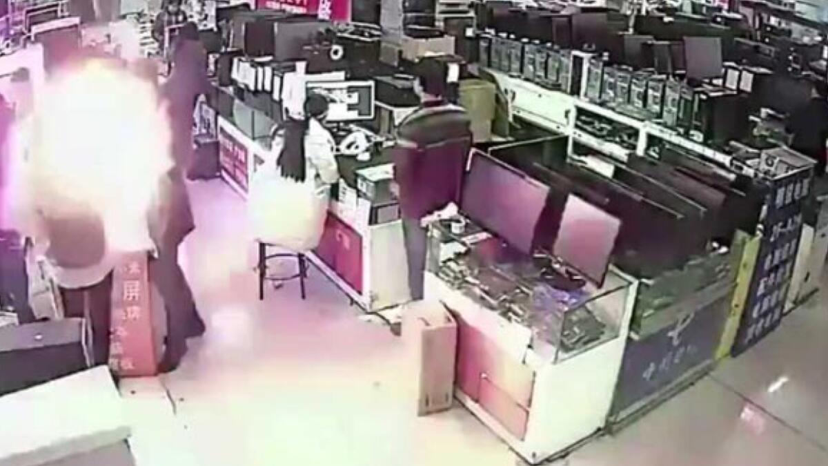 Video: Man bites iPhone battery and it explodes in his face in China store