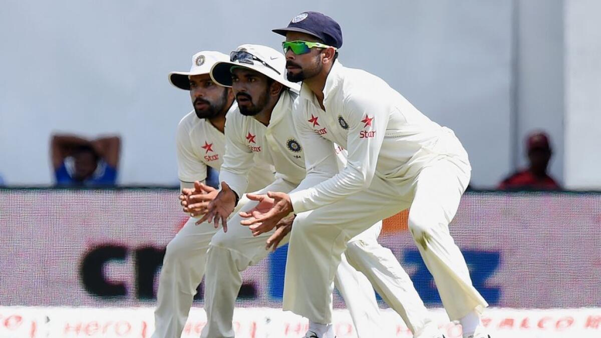 Indian cricket team captain Virat Kohli (R), Lokesh Rahul (C) and Rohit Sharma look on the slip cordon during the third day of their third and final Test cricket match between Sri Lanka and India at the Sinhalese Sports Club (SSC) in Colombo.