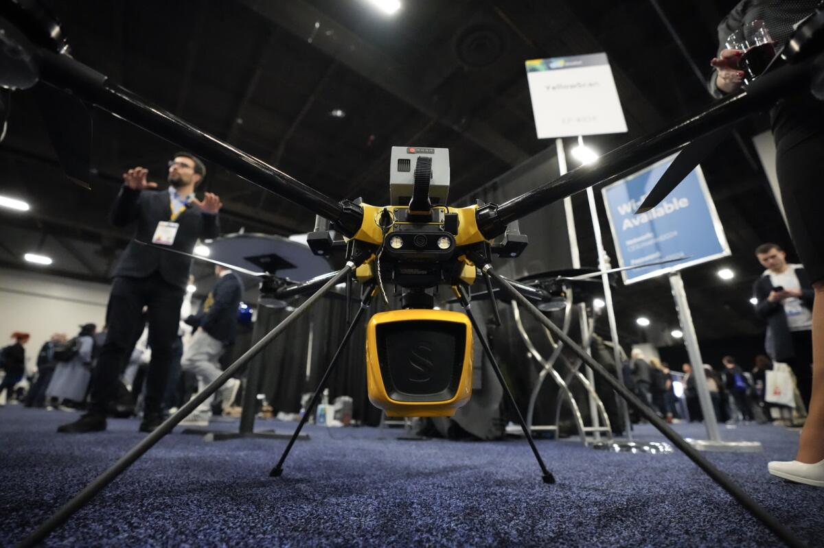 A YellowScan Navigator bathymetric LiDAR system is seen attached to a drone during CES in Las Vegas. The system is designed for surveying land and waterbeds.  — AP