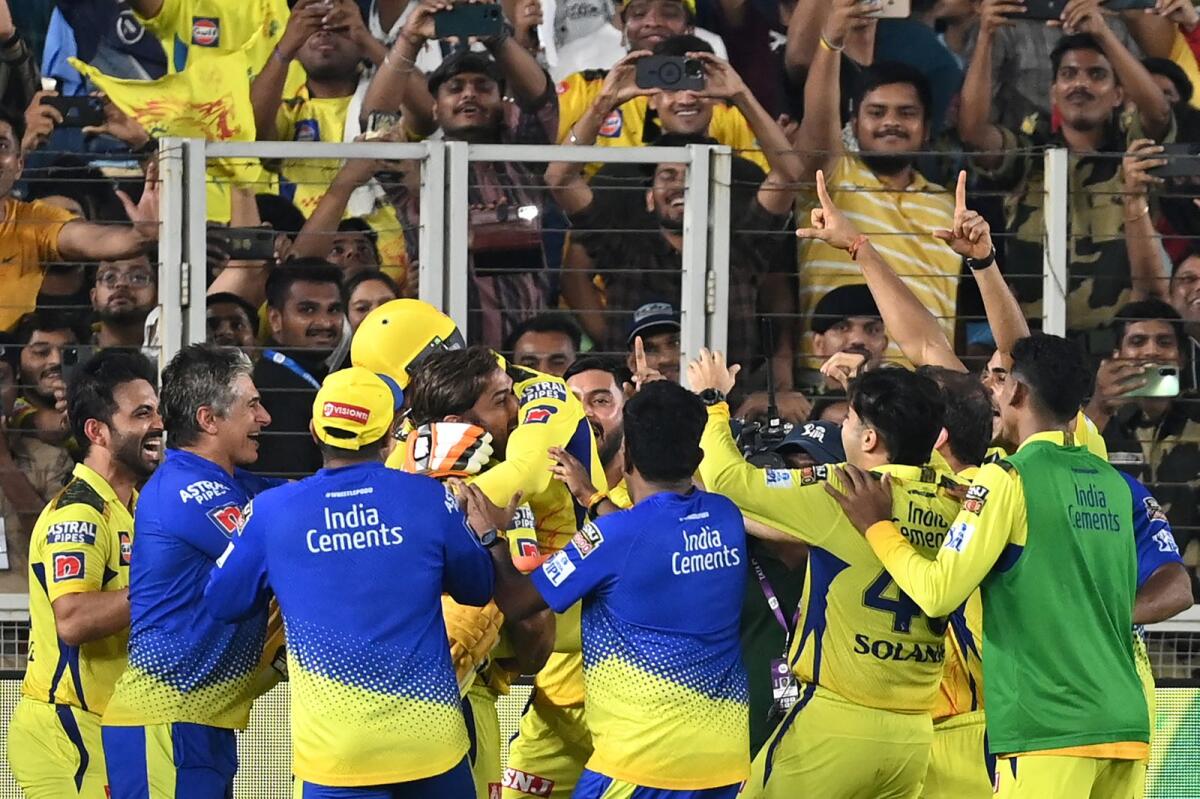 Chennai Super Kings' players celebrate their win at the end of the Indian Premier League (IPL) Twenty20 final cricket match between Gujarat Titans and Chennai Super Kings at the Narendra Modi Stadium in Ahmedabad on May 30, 2023. Photo: AFP
