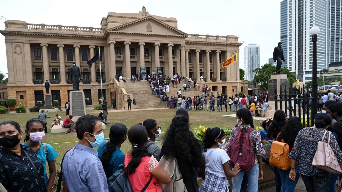 People line up to visit presidential secretariat in Colombo on July 11, 2022, after it was overrun by anti-government protestors. Photo: AFP