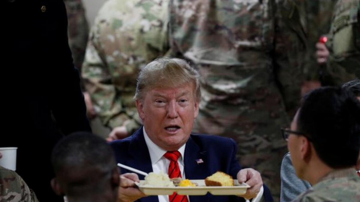 President Donald Trump eats dinner with U.S. troops at a Thanksgiving dinner event during a surprise visit at Bagram Air Base in Afghanistan. Reuters