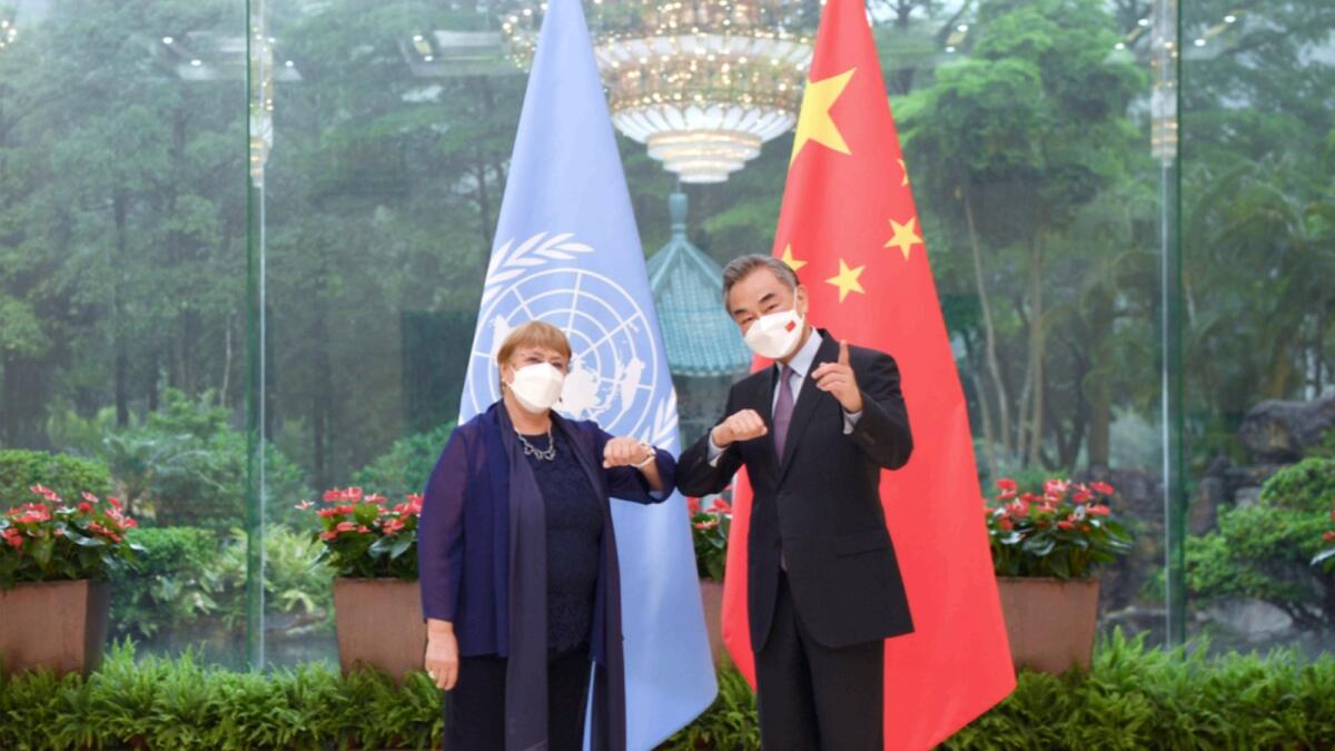Chinese Foreign Minister Wang Yi meets with the United Nations High Commissioner for Human Rights Michelle Bachelet in Guangzhou. — AP