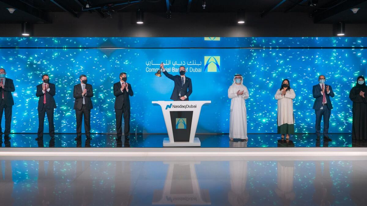 Dr. Bernd van Linder, Chief Executive of Commercial Bank of Dubai, rings market-opening bell to celebrate listing of $600 million bond on Nasdaq Dubai.