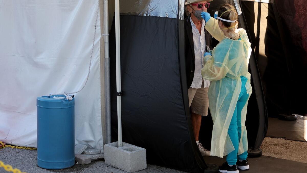 A person takes a Covid test in North Miami, Florida. — AFP