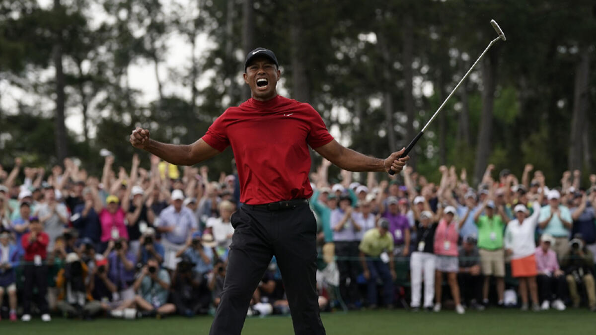 Woods wins Masters to claim first major in 11 years