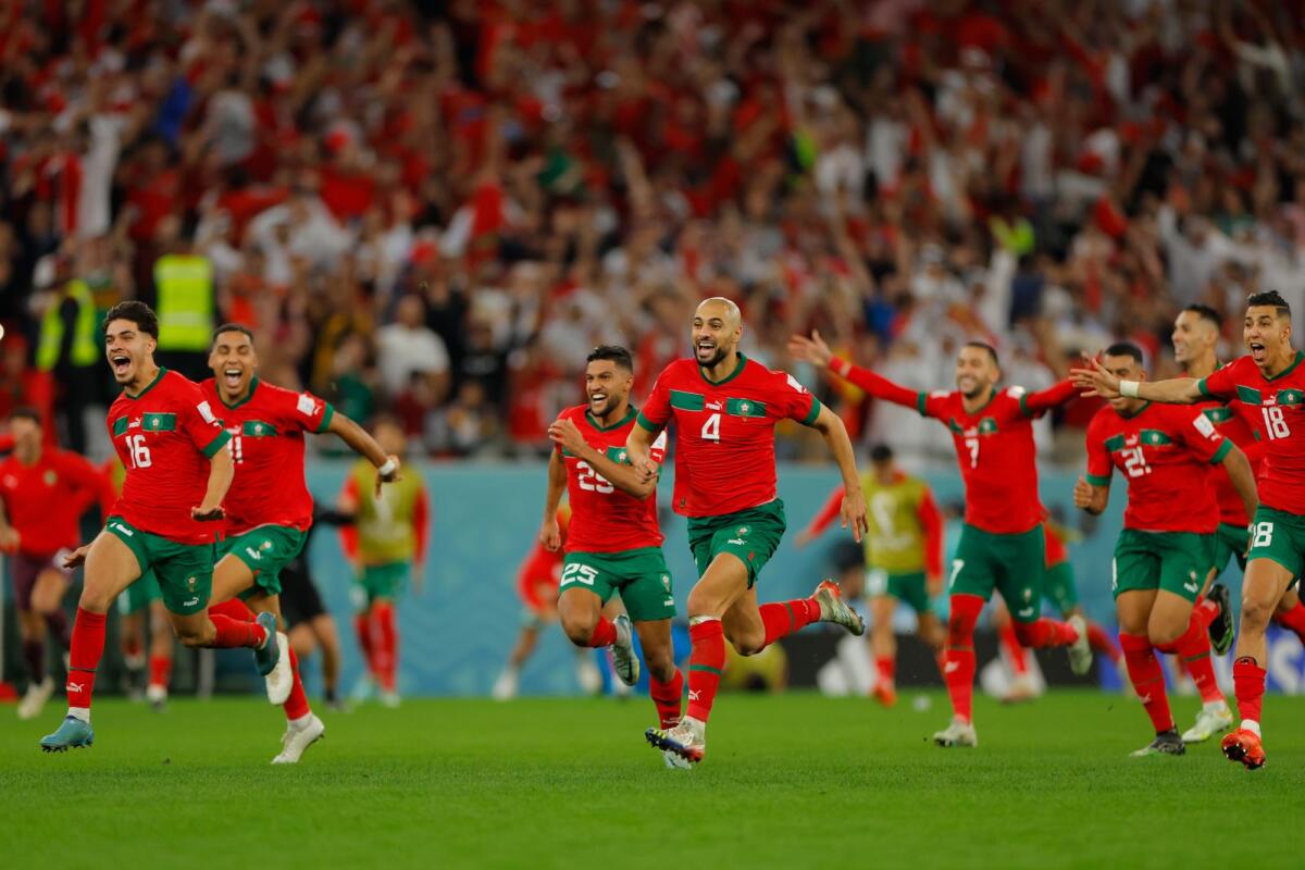 Morocco players celebrate after they won on penalty shoot-out the Qatar 2022 World Cup round of 16.  Photo: AFP