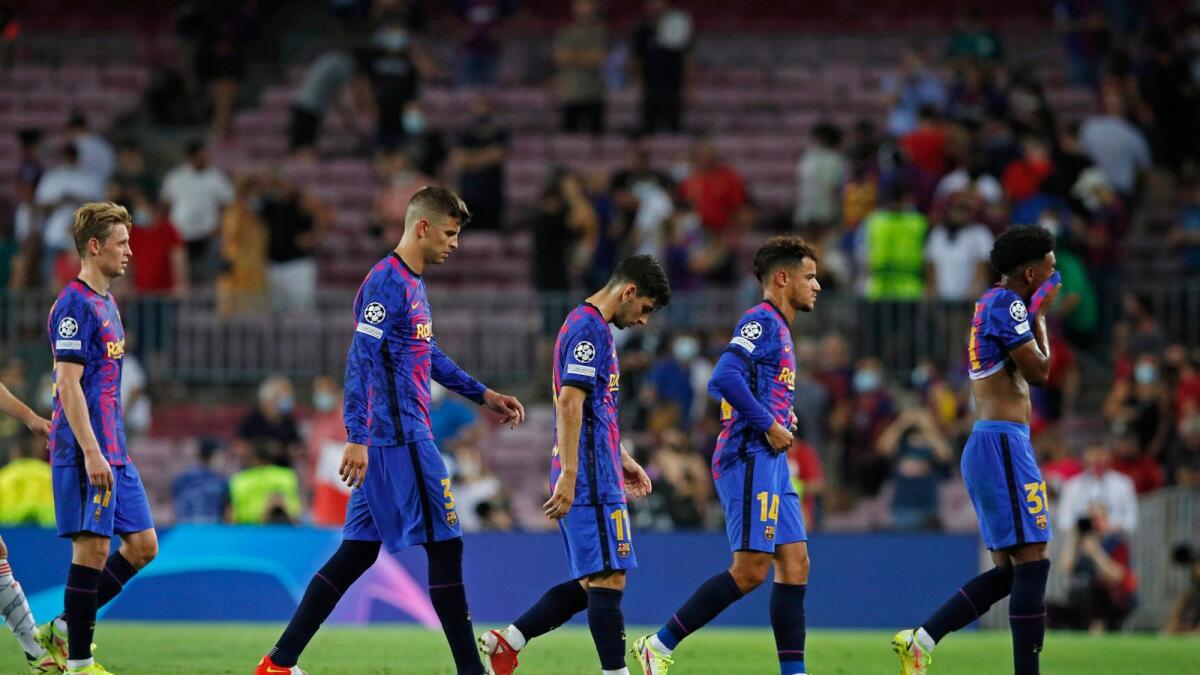 Barcelona's Gerard Pique and teammates look dejected after the defeat to Bayern Munich. (Reuters)