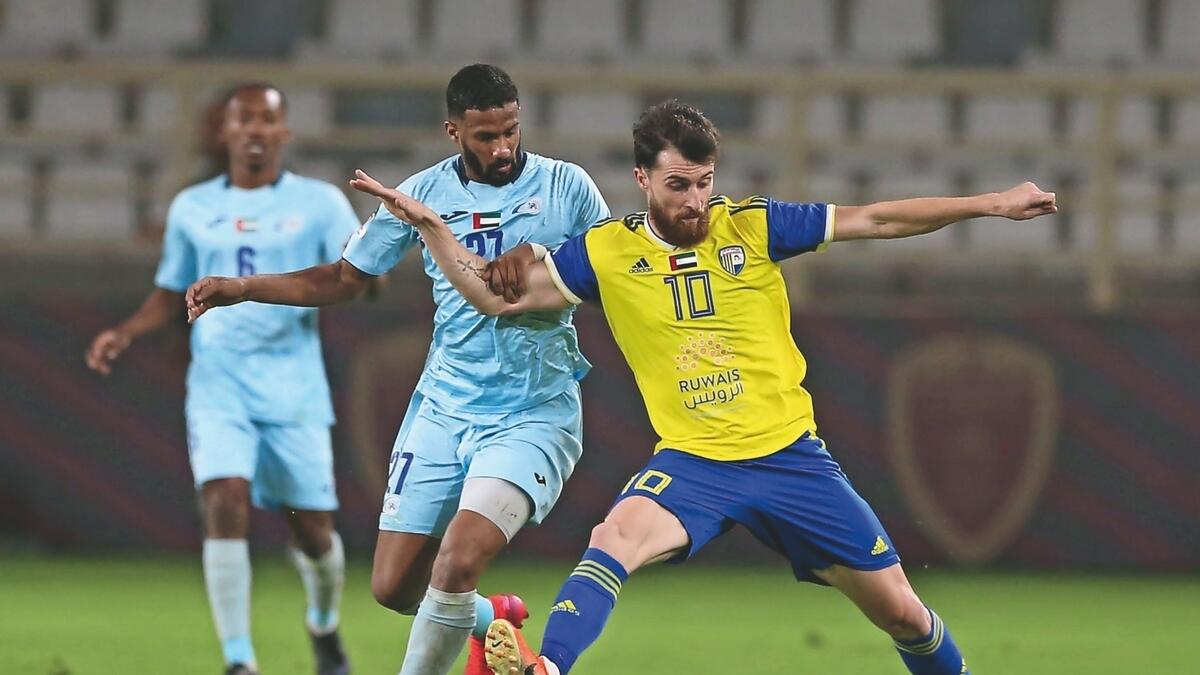 TACKLE: Al Dhafra and Bani Yas players vie for the ball. - Twitter