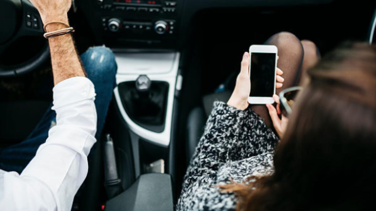 You could be fined Dh1,000 in UK for using mobile phone on passenger seat 