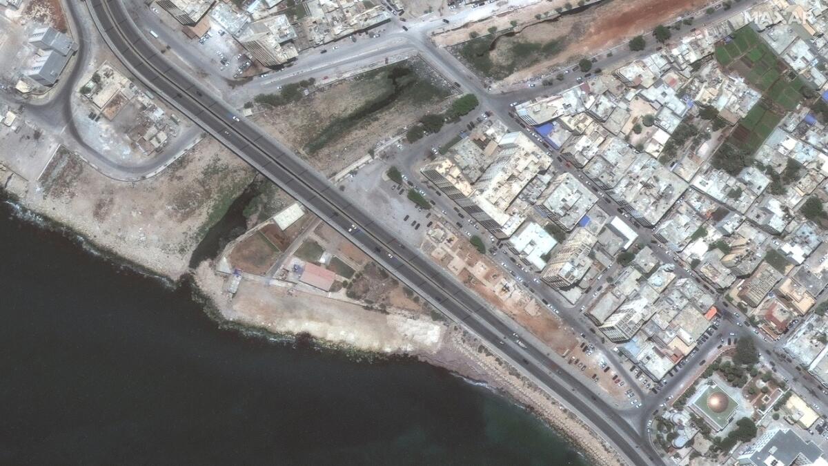 This combination of satellite images from Maxar Technologies shows a coastal roadway in Derna, Libya, on July 1, 2023, top, and the same flood damaged area on Wednesday. — A