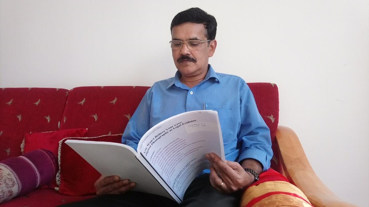 Janardhanan Das Kunhimangalam with one of his research works.-Photo by Ashwani Kumar/Khaleej Times