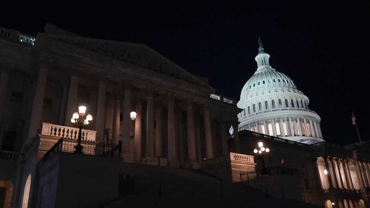 Lights illuminate the Capitol after House Speaker Kevin McCarthy of Calif., announced that he and President Joe Biden had reached an 'agreement in principle' to resolve the looming debt crisis on Saturday. — AP