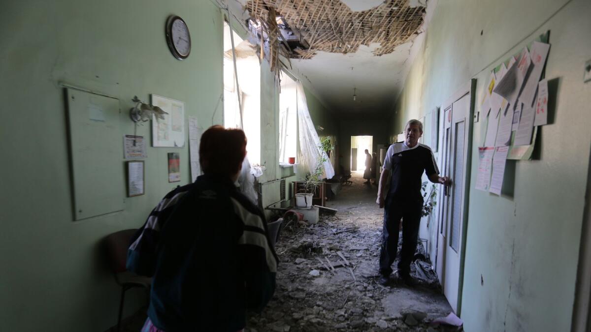 Patient attends in a hospital destroyed as a result of the shelling between Ukrainian forces and pro-Russian separatists in eastern Ukrainian city of Donetsk on July 19, 2015. Photo: AFP