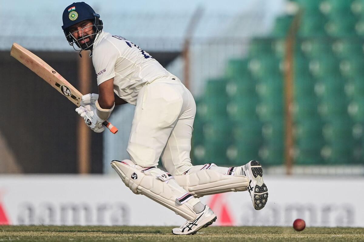India's Cheteshwar Pujara plays a shot during the first day of the first Test against  Bangladesh. — AFP