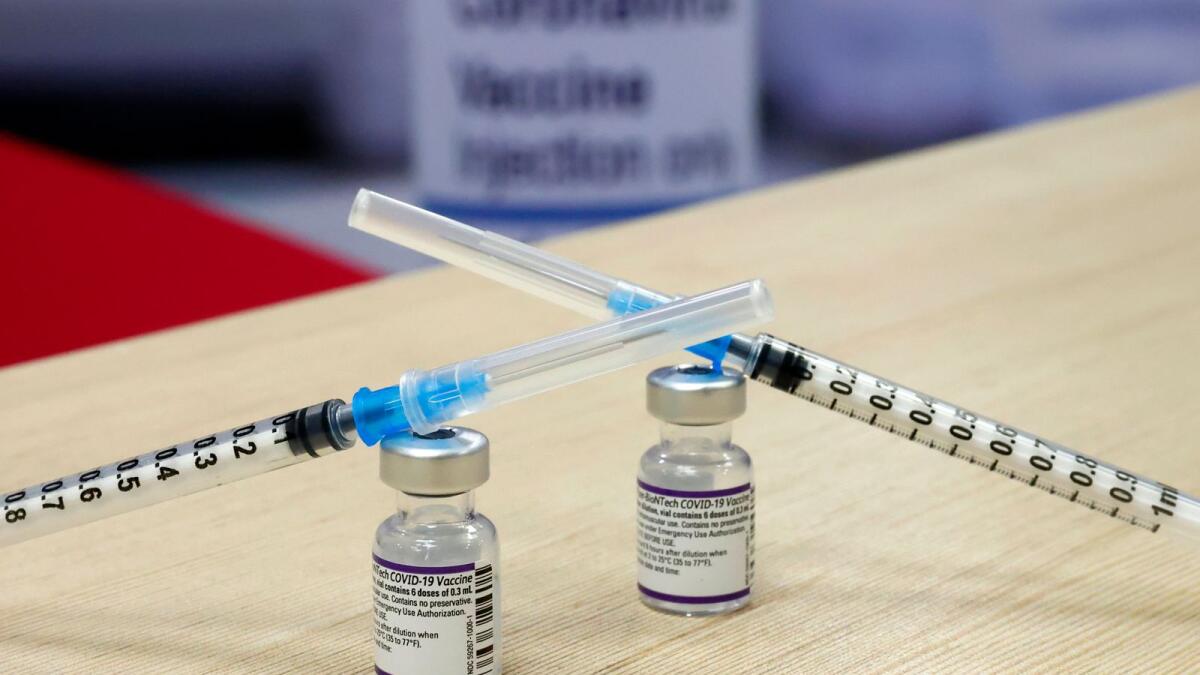 This pictured shows syringes and vials of the Pfizer-BioNTech vaccine against the coronavirus, at the outpatient clinics of the cardiovascular centre at Sheba Medical Center in Ramat Gan, near the Israeli coastal city of Tel Aviv, on December 31, 2021. (Photo: AFP)