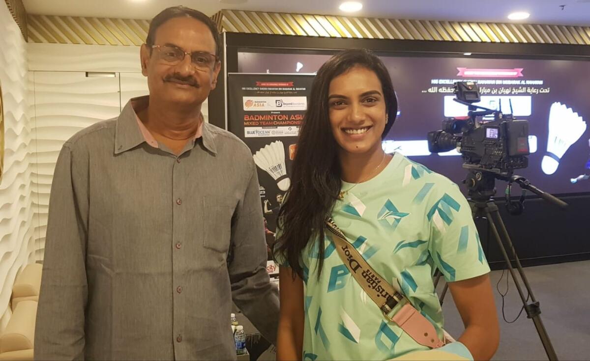 PV Ramana with Sindhu after the draw ceremony for the Badminton Asia Mixed Team Championship in Dubai. – Photo by Rituraj Borkakoty