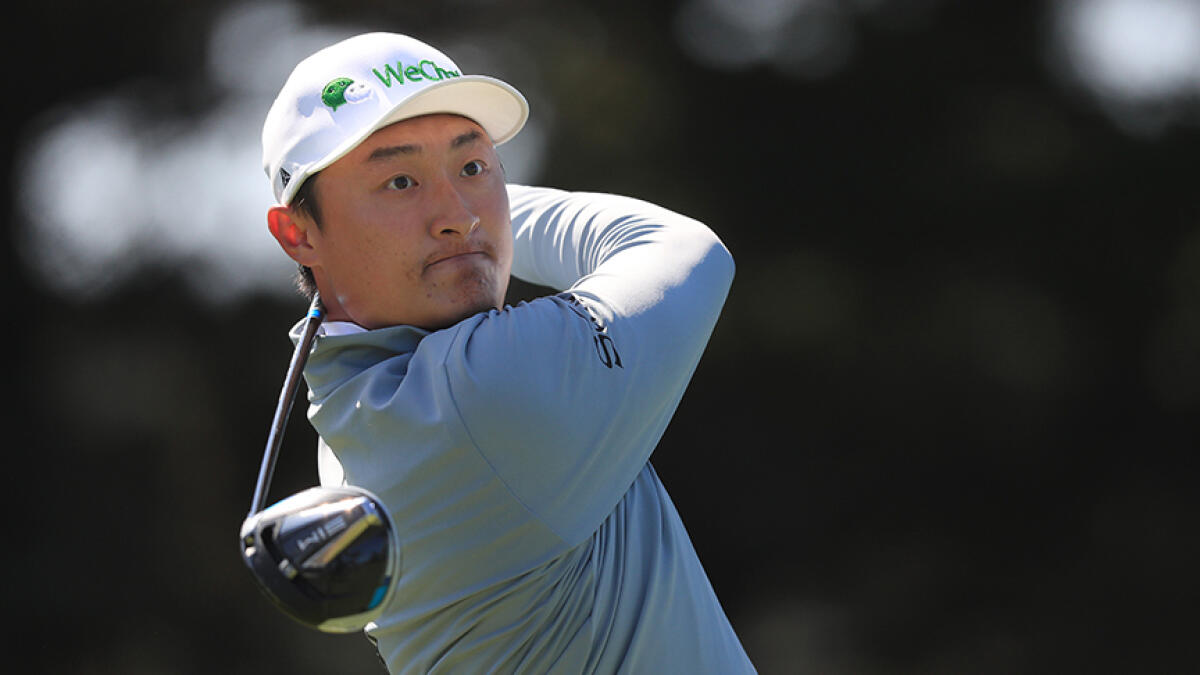 Haotong Li of China fired a bogey-free 65 to lead in the first major championship of the pandemic-interrupted season. -- AFP