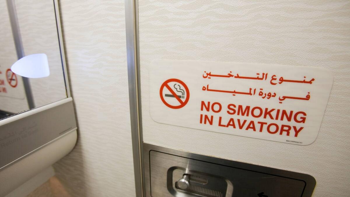 Passenger caught smoking in flight toilet, held after landing
