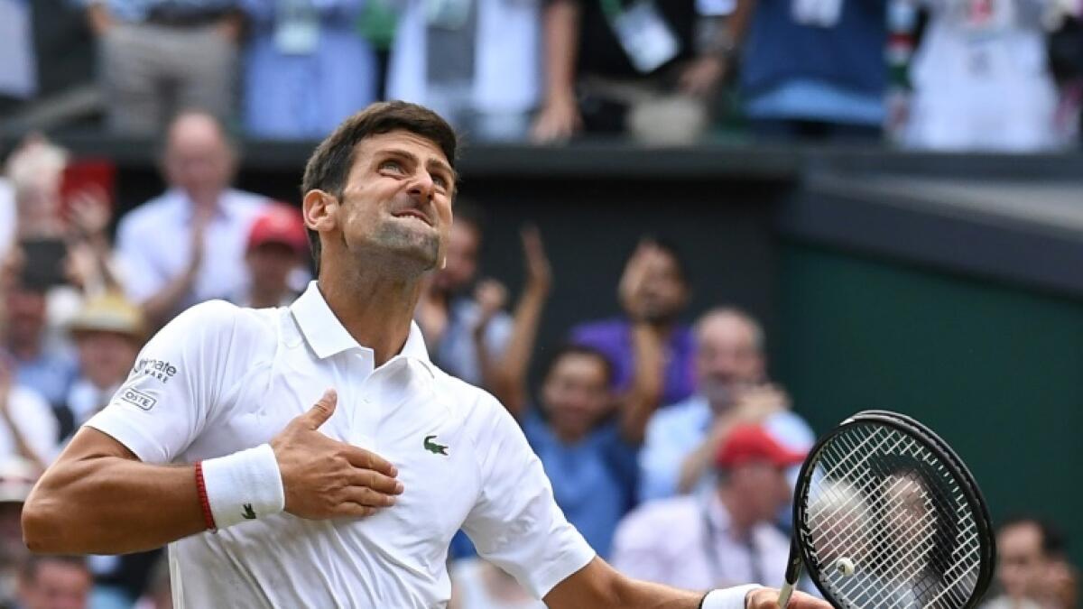Novak Djokovic celebrates his victory over Roger Federer in the 2019 Wimbledon final. - AFP file