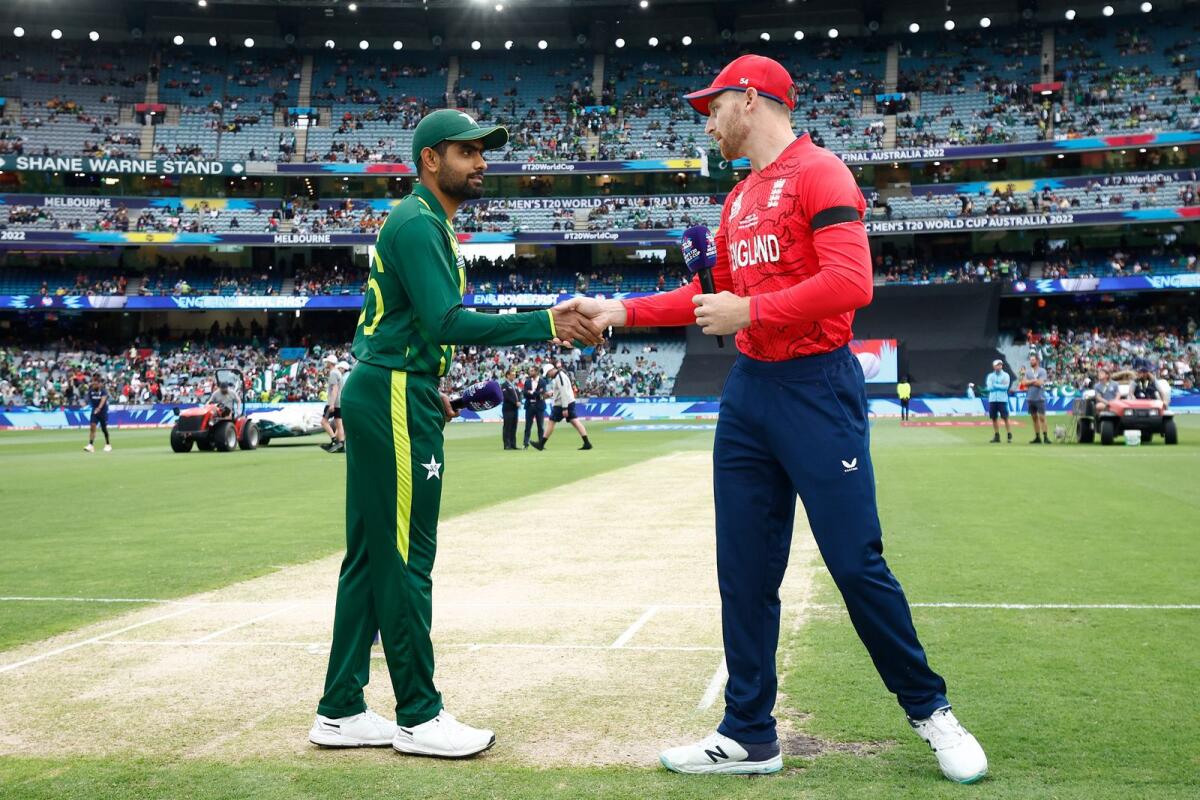 Pakistan captain Babar Azam (left) and England skipper Jos Buttler shake hands at the toss. — Melbourne Cricket Ground Twitter